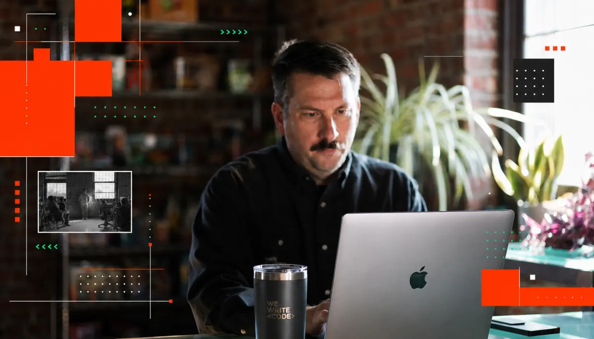 Developer working on laptop in office