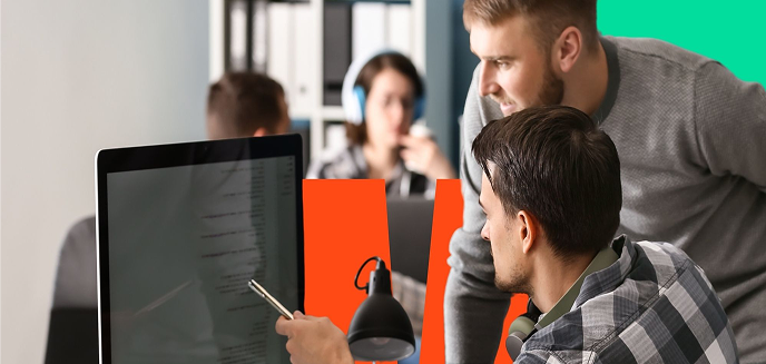 Team members working at desks in an office