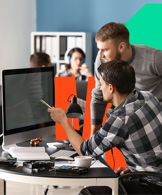 Team members working at desks in an office