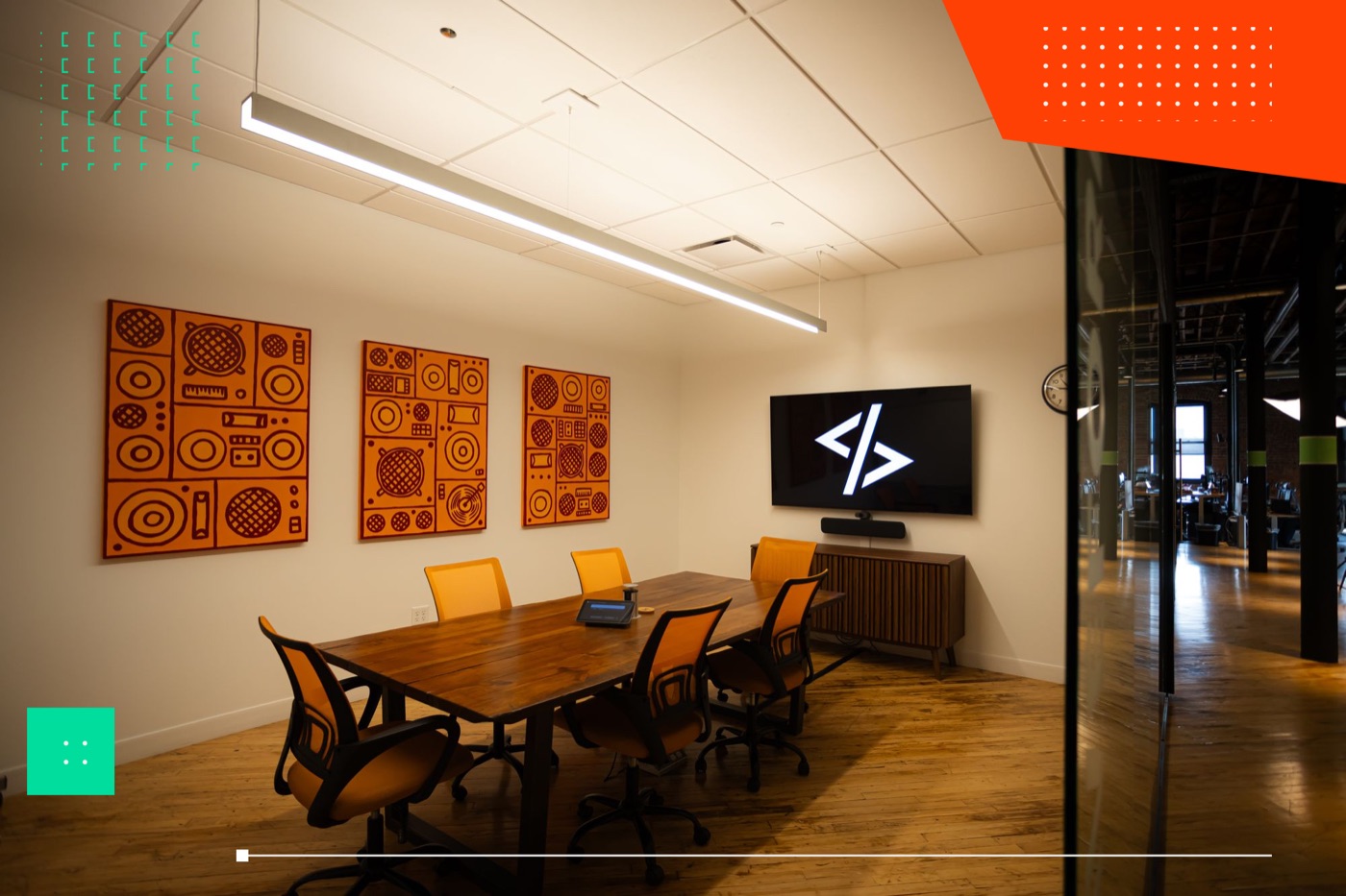 WWC conference room with the team's code logo on screen