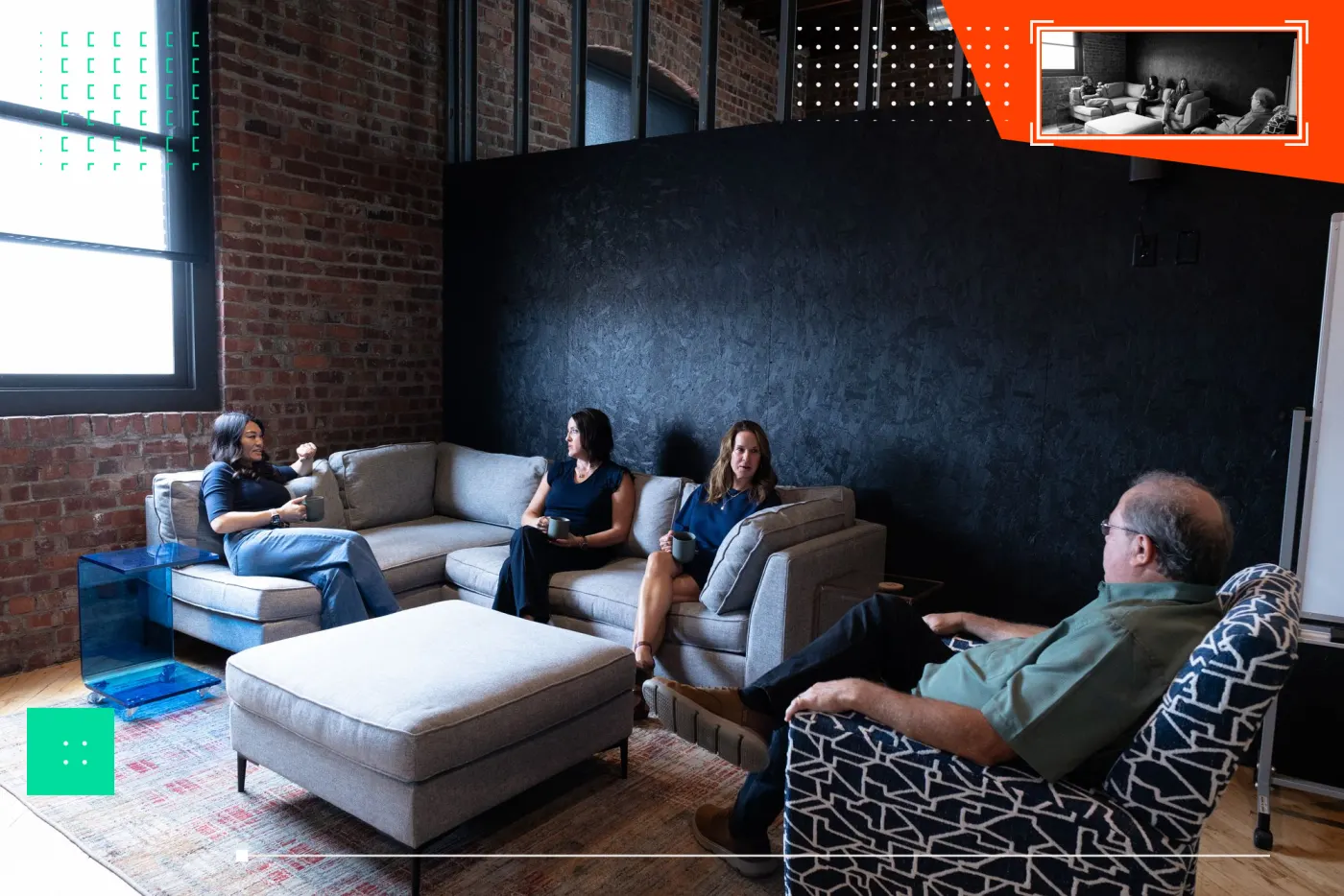 WWC team members having a conversation in a lounge area