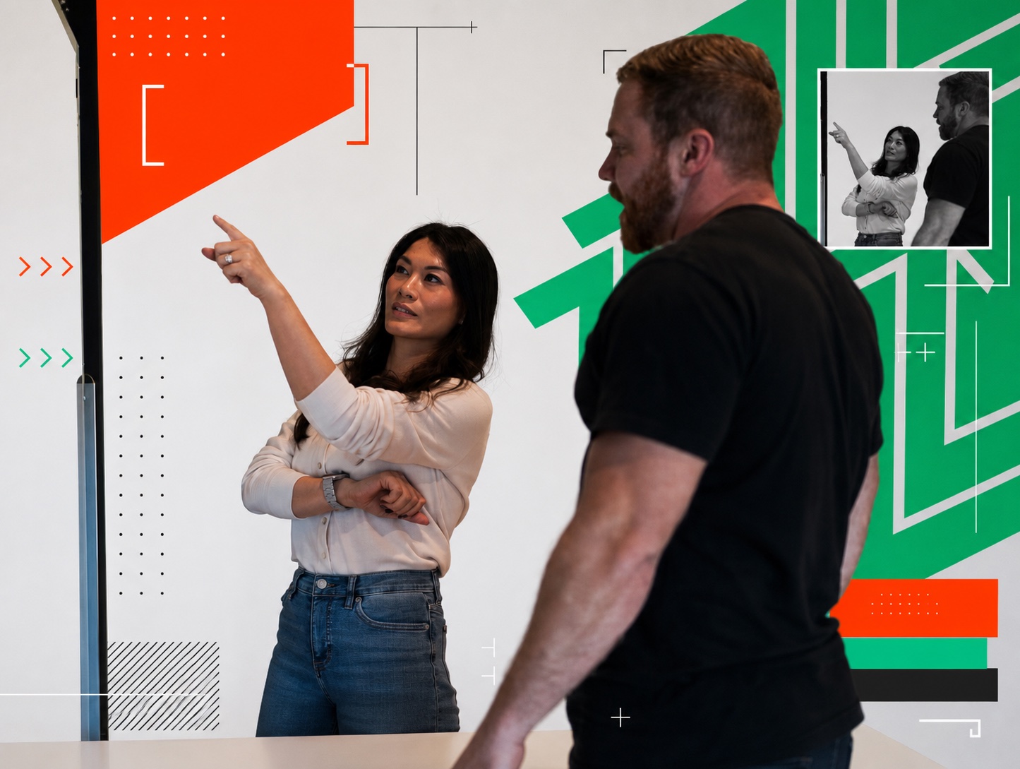 Woman presenting at a whiteboard during team meeting